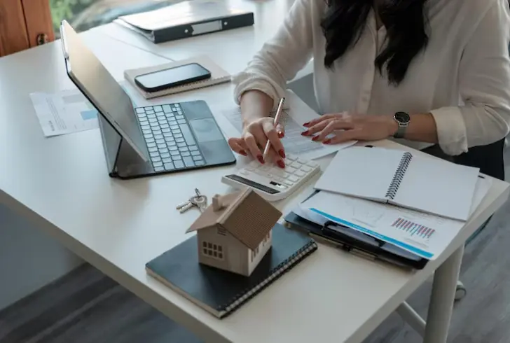 Woman calculating mortgage costs